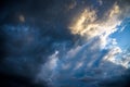 CLOSE UP: Dark grey stormy clouds gather above Lake Maggiore on a calm summer evening. Dramatic shot of clouds covering up the Royalty Free Stock Photo