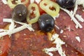 Close up of dark olives and paprika on a homebaked pizza Royalty Free Stock Photo