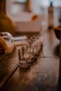 close up dark photo of barman pouring homemade liqueur