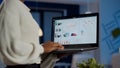 Close up of dark skin woman typing on laptop standing in start up office Royalty Free Stock Photo