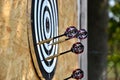 Close up of darts arrows being stuck in the target board Royalty Free Stock Photo