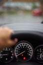 Close up of dashboard, speedometer and tachometer with white backlight. modern car interior Royalty Free Stock Photo