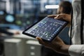 Close up of data center developer running AI forecasting simulations on tablet Royalty Free Stock Photo