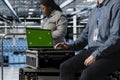 Close up of data center employee using green screen notebook Royalty Free Stock Photo