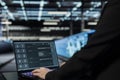 Close up of data center engineer using AI assistant on laptop Royalty Free Stock Photo