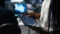 Close up of data center engineer using tablet to review code Royalty Free Stock Photo