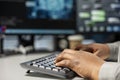 Close up of data center programmer typing on PC keyboard, using AI Royalty Free Stock Photo