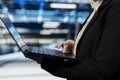 Close up of data center worker using laptop to do maintenance on electronics Royalty Free Stock Photo