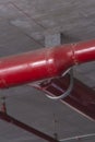 Close up datail of big red firefighter water pipe.