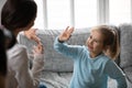 Close up deaf little girl communicating with mother Royalty Free Stock Photo