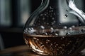 close-up of decanter, with droplets of water resting on the glass