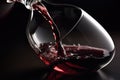close-up of decanter, with red wine spilling out