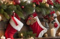 A close-up of a decorated Christmas mantle with stockings and candles, Generated AI Royalty Free Stock Photo