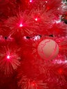 Close up of decorated christmas tree with red led lights Royalty Free Stock Photo