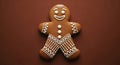 Close-up of a decorated gingerbread man cookie on a brown textured background Royalty Free Stock Photo
