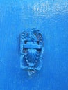 Closeup of Decorative antique Knocker on dark Blue Door Royalty Free Stock Photo