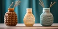 Close up of decorative jars and vase decoraed with Macrame knotting on wooden table. Home decor and accent pieces