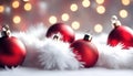 Close up of decorative red baubles on white fur.