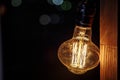 Close up decorative vintage edison style light bulbs against dark background at night Royalty Free Stock Photo