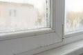 Close up of a defective plastic window with condensation and freezing inside. Poor ventilation  high humidity Royalty Free Stock Photo