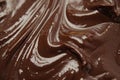 Close-up of delectable chocolate frosting and icing, AI-generated.