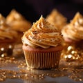 Close-up Delicious appetizing cupcakes with vanilla cream and gold sprinkles