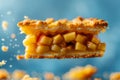 Close up of Delicious Apple Pie Slice Suspended in Air with Crumbs Floating, Blue Background