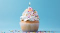 A close-up of a delicious birthday cupcake topped with sprinkles