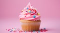 A close-up of a delicious birthday cupcake topped with sprinkles