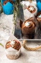 Close up. Delicious chocolate muffins. Top decorated with a cream hat with Christmas snowflakes of mastic. Gray background Royalty Free Stock Photo