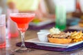 Close up of delicious fresh burger with tasty cocktail Royalty Free Stock Photo