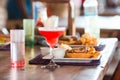 Close up of delicious fresh burger with tasty cocktail Royalty Free Stock Photo