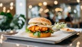 Close-up of delicious fresh tasty chicken burger on table. Cafe interior. Tasty fast food Royalty Free Stock Photo