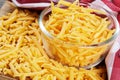 Close up of delicious Grated Cheddar Cheese on wooden background