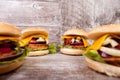 Close up of Delicious home made burgers on wooden plate Royalty Free Stock Photo