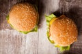 Close up of Delicious home made burgers on wooden plate Royalty Free Stock Photo