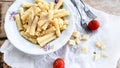 Sedani rigati pasta cacio e pepe with cherry tomatoes and parmesan cheese