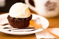 Close up of a delicious icecream on top of a brownie with a chocolate sauce in plate Royalty Free Stock Photo