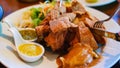 Close up delicious juicy yummy crispy Deep fried pork knuckle in white plate cooked in Thai style s