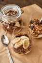 Close up of delicious layered dessert in glass jar, Homemade yogurt with granola and berries, Granola baked with nuts Royalty Free Stock Photo