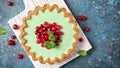 Close-up of delicious mint open tart with fresh cranberry