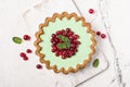 Close-up of delicious mint open tart with fresh cranberry