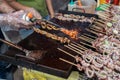 close up of delicious satay grilled squid, for sale in street food