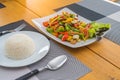 Close up delicious special thai food  Stir fried Chicken with cashew nuts not spicy with steamed rice ,decorate on wooden table Royalty Free Stock Photo