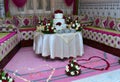 Close-up of delicious white wedding cake decorated with pink roses Royalty Free Stock Photo