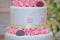 Close-up of delicious white wedding cake decorated with pink roses Royalty Free Stock Photo