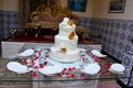 Close-up of delicious white wedding cake decorated with pink roses Royalty Free Stock Photo