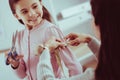 Close up of delighted daughter helping her mother with measurements