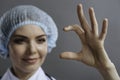 Close up of delighted doctor showing something with her hands