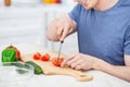 Close up of delighted man that cooking dinner